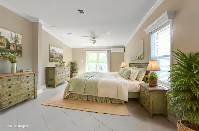 a spacious bedroom with a bed and a dresser