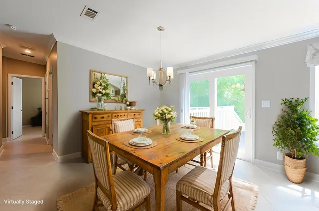 a view of a dining room with furniture and window