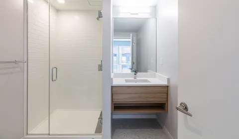 a bathroom with a sink and mirror