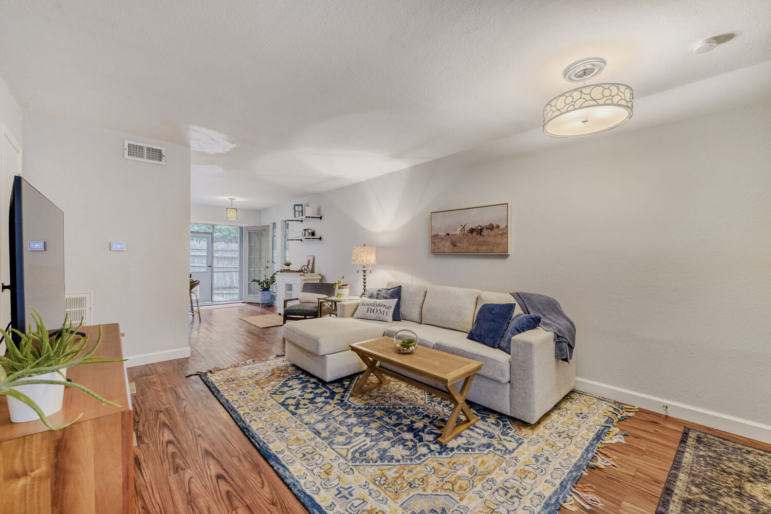 1912 Lightsey Road, Unit 6 Austin, TX 78704 - Photo 5 of 27 a living room with furniture and a rug