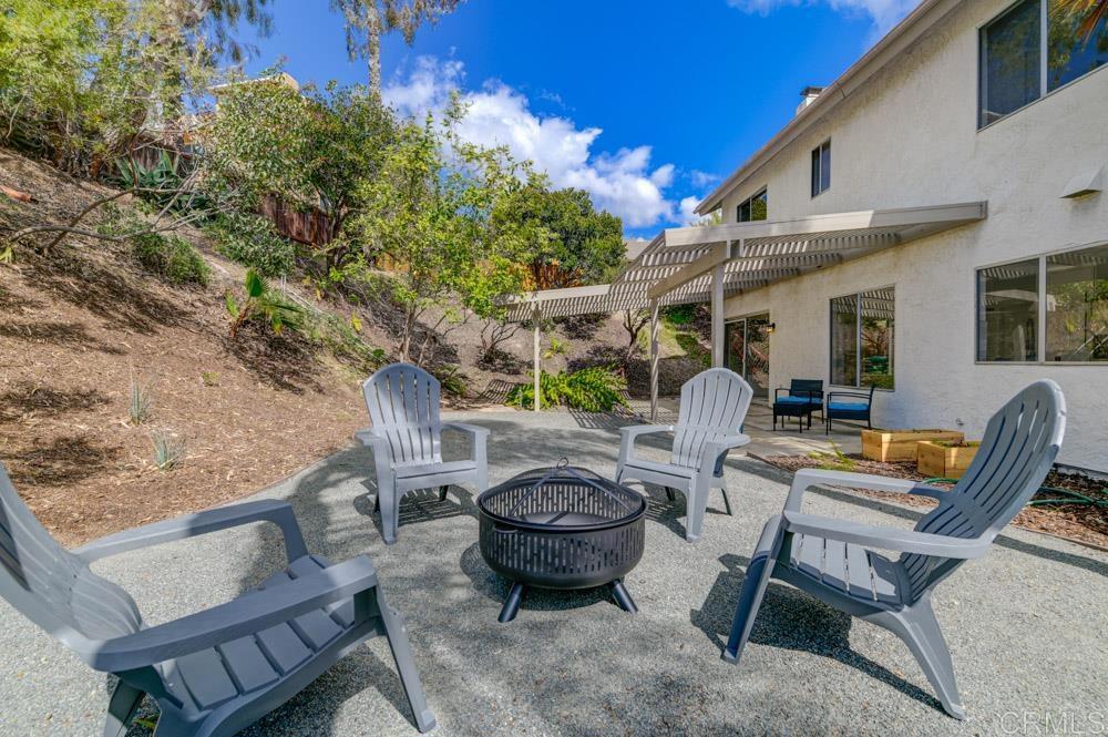 3573 Evening Canyon Road Oceanside, CA 92056 - Photo 18 of 45 a view of a patio with couple of chairs and a fountain