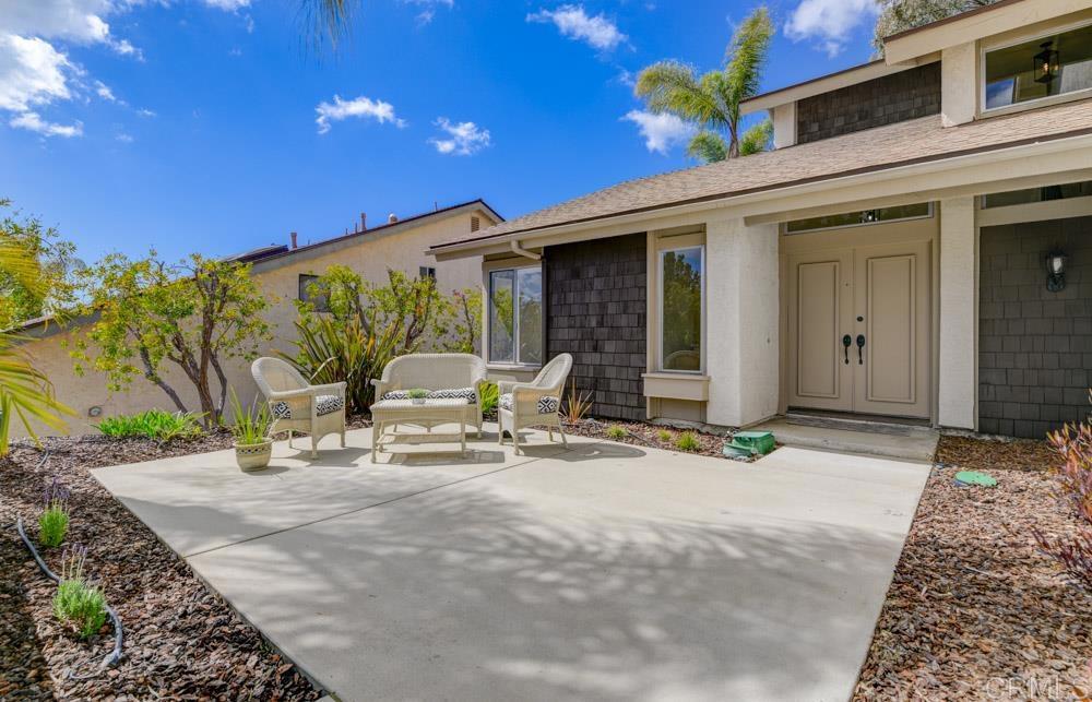 3573 Evening Canyon Road Oceanside, CA 92056 - Photo 2 of 45 a backyard of a house with table and chairs