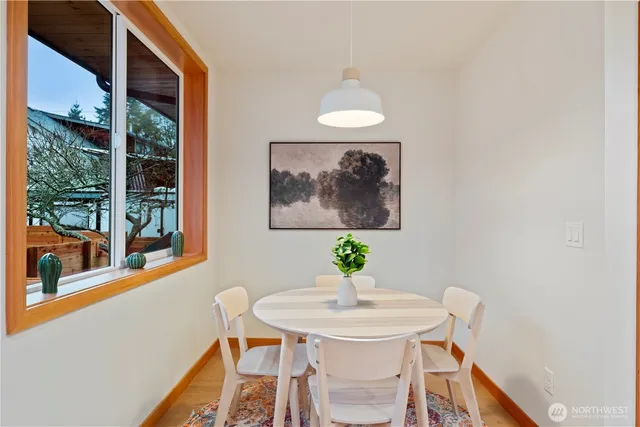 a view of a dining room with furniture window and outside view