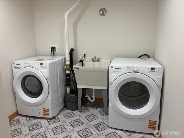 a utility room with dryer and washer