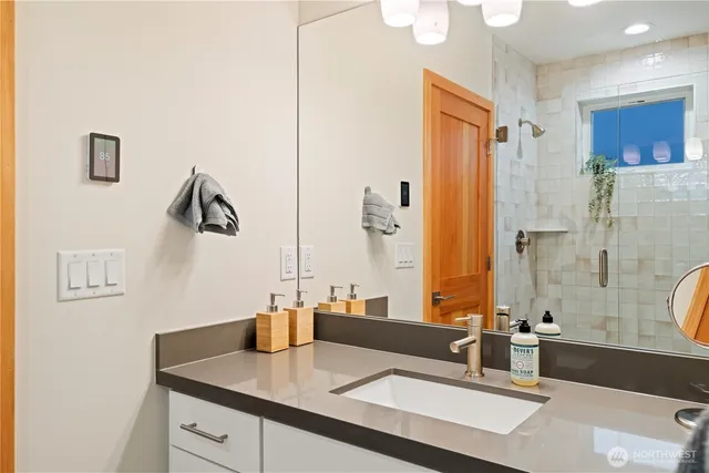 a bathroom with a sink and a mirror
