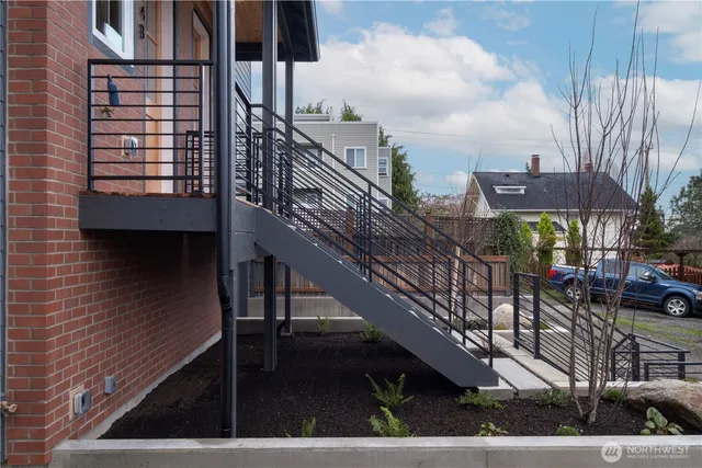 a front view of a house with garden and patio