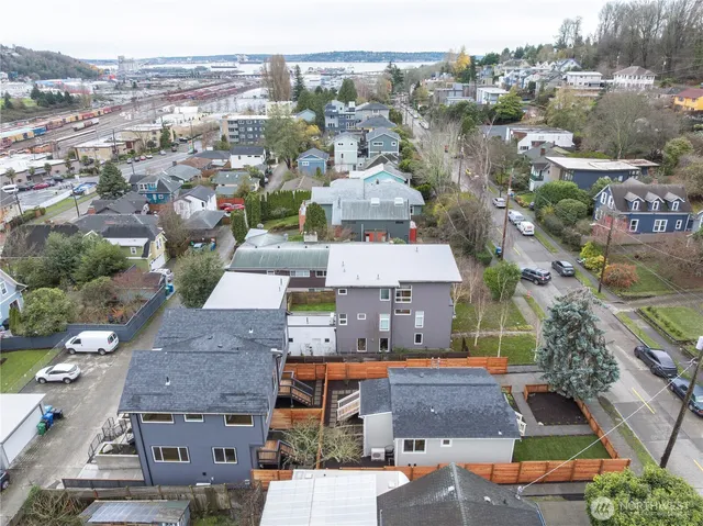 a view of a brick house with many windows