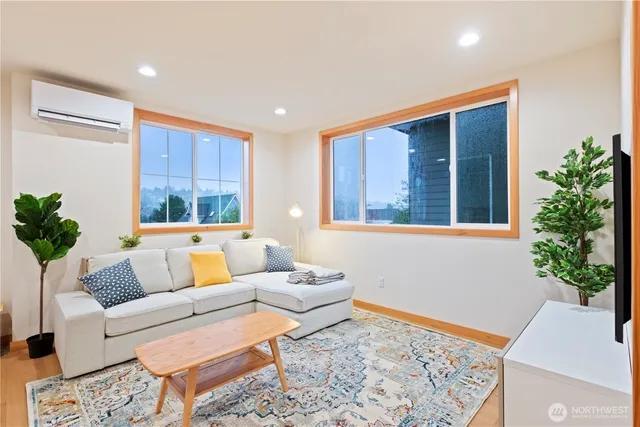 a living room with furniture and flowers
