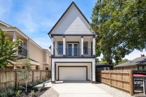 a front view of a house with garage