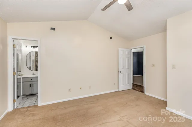 a view of a hallway to a bedroom
