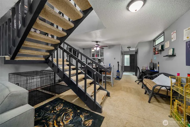 a living room with lots of furniture and a dining table