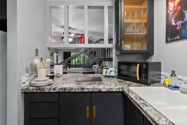a kitchen with sink cabinets and window