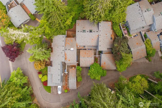 an aerial view of residential houses with outdoor space