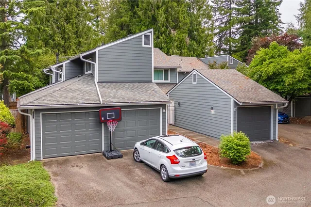 a car parked in front of white house
