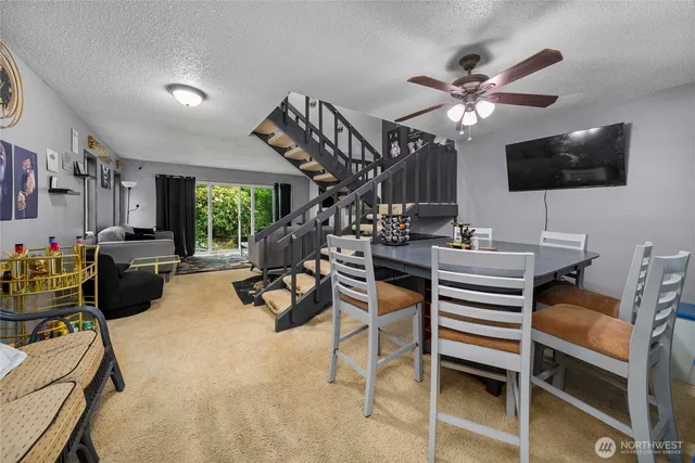 a view of a livingroom with furniture and a flat screen tv