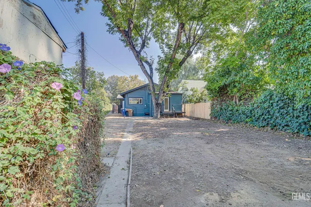 front view of a house with a tree