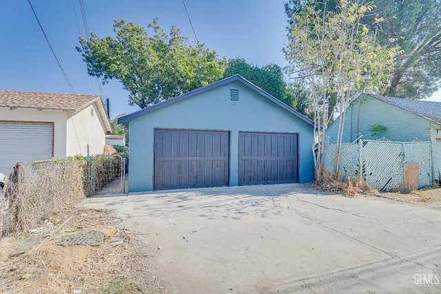 a house with a tree in front of it