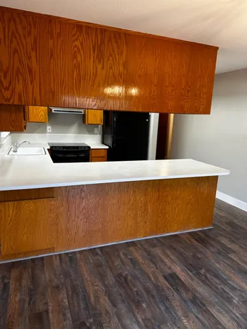 a view of room with wooden floor