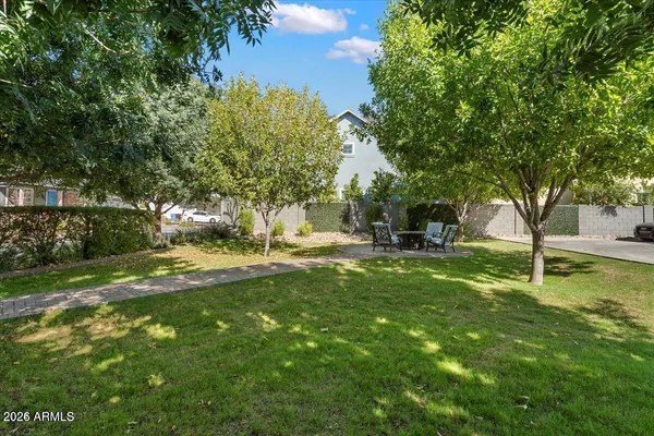 a view of a table and chairs in the garden