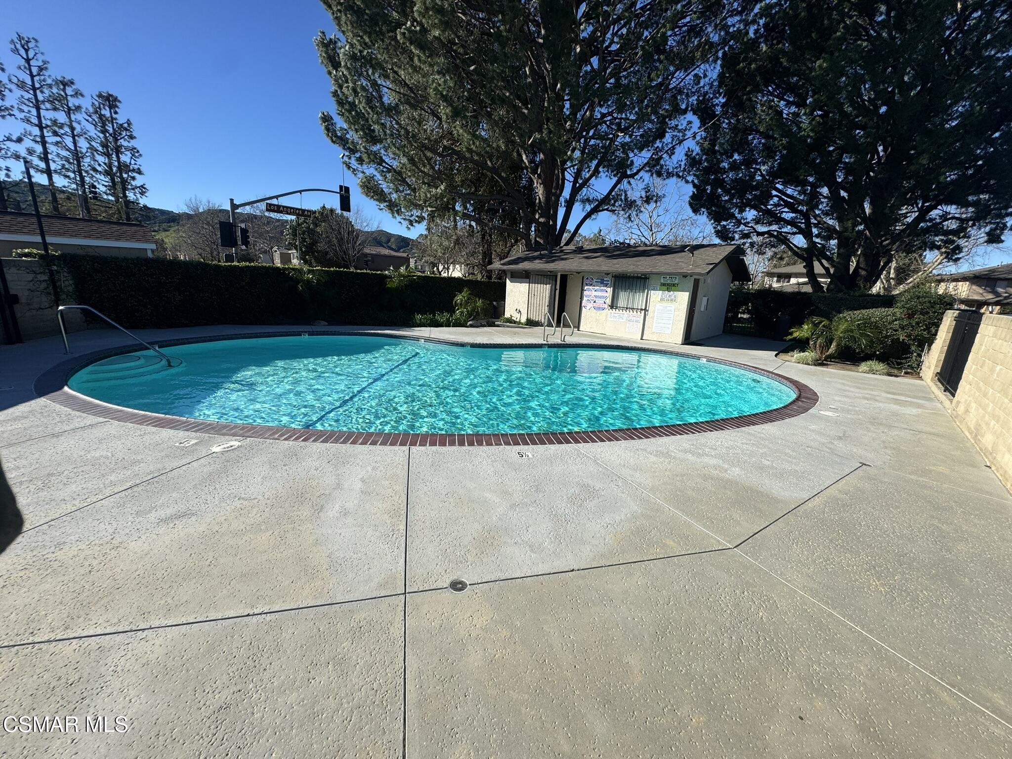 2030 Avenida Placida, Unit 4 Simi Valley, CA 93063 - Photo 15 of 18 a front view of a house with a garden