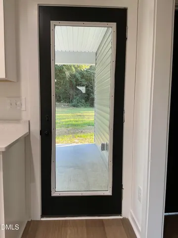 a view of a room that has a large window