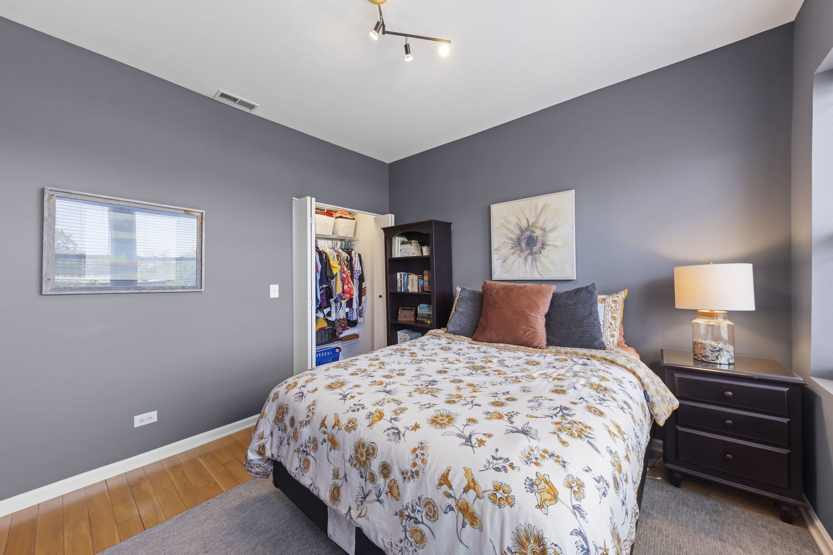 5054 North Troy Street, Unit 3 Chicago, IL 60625 - Photo 14 of 31 a bedroom with a bed and a lamp on dresser