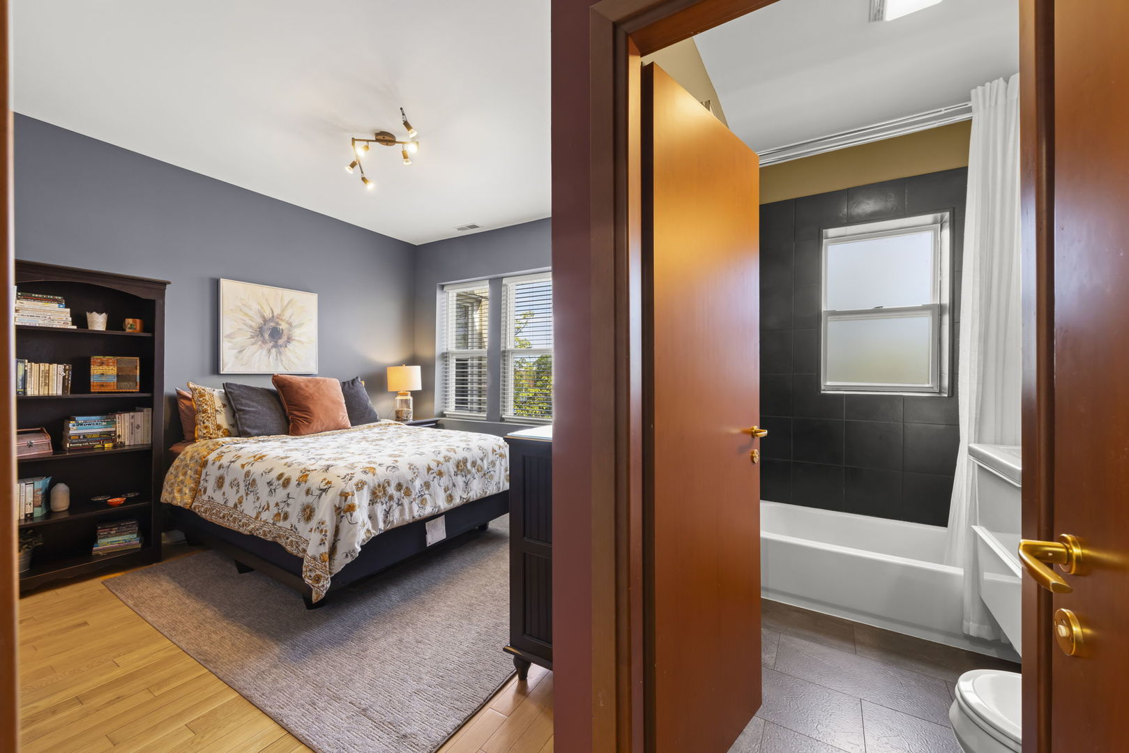 5054 North Troy Street, Unit 3 Chicago, IL 60625 - Photo 15 of 31 a bedroom with a bed and a potted plant on dresser