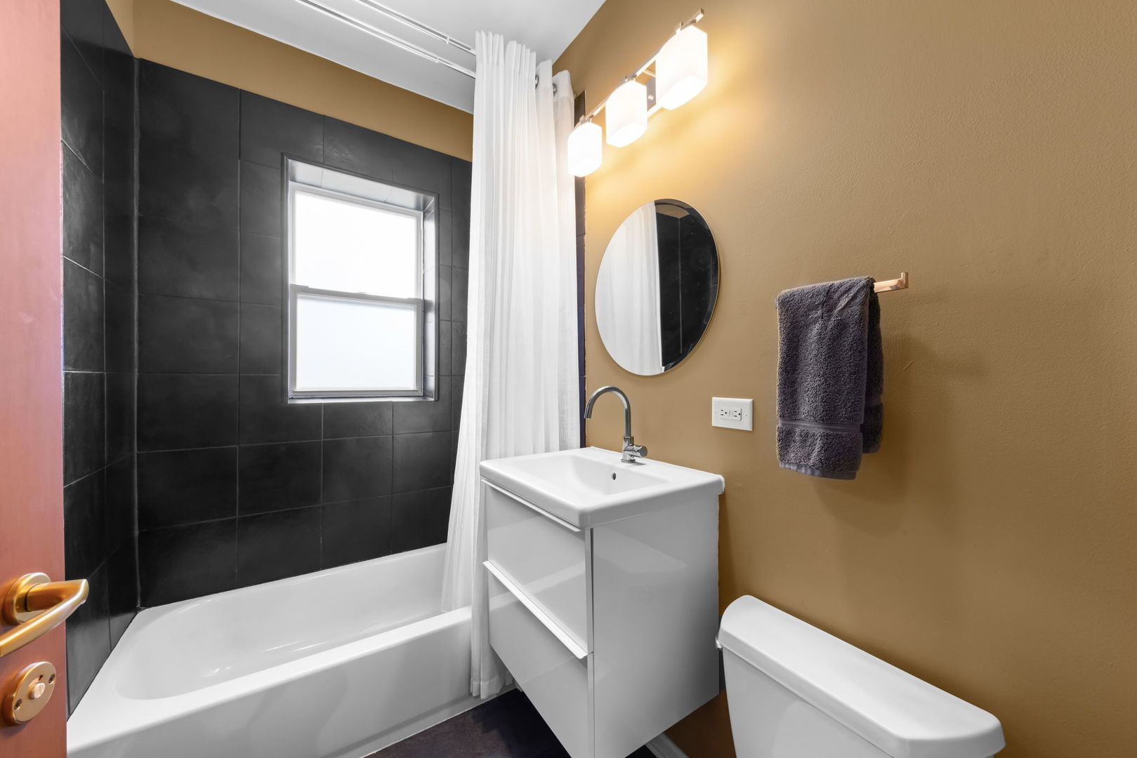 5054 North Troy Street, Unit 3 Chicago, IL 60625 - Photo 16 of 31 a bathroom with a sink toilet and shower