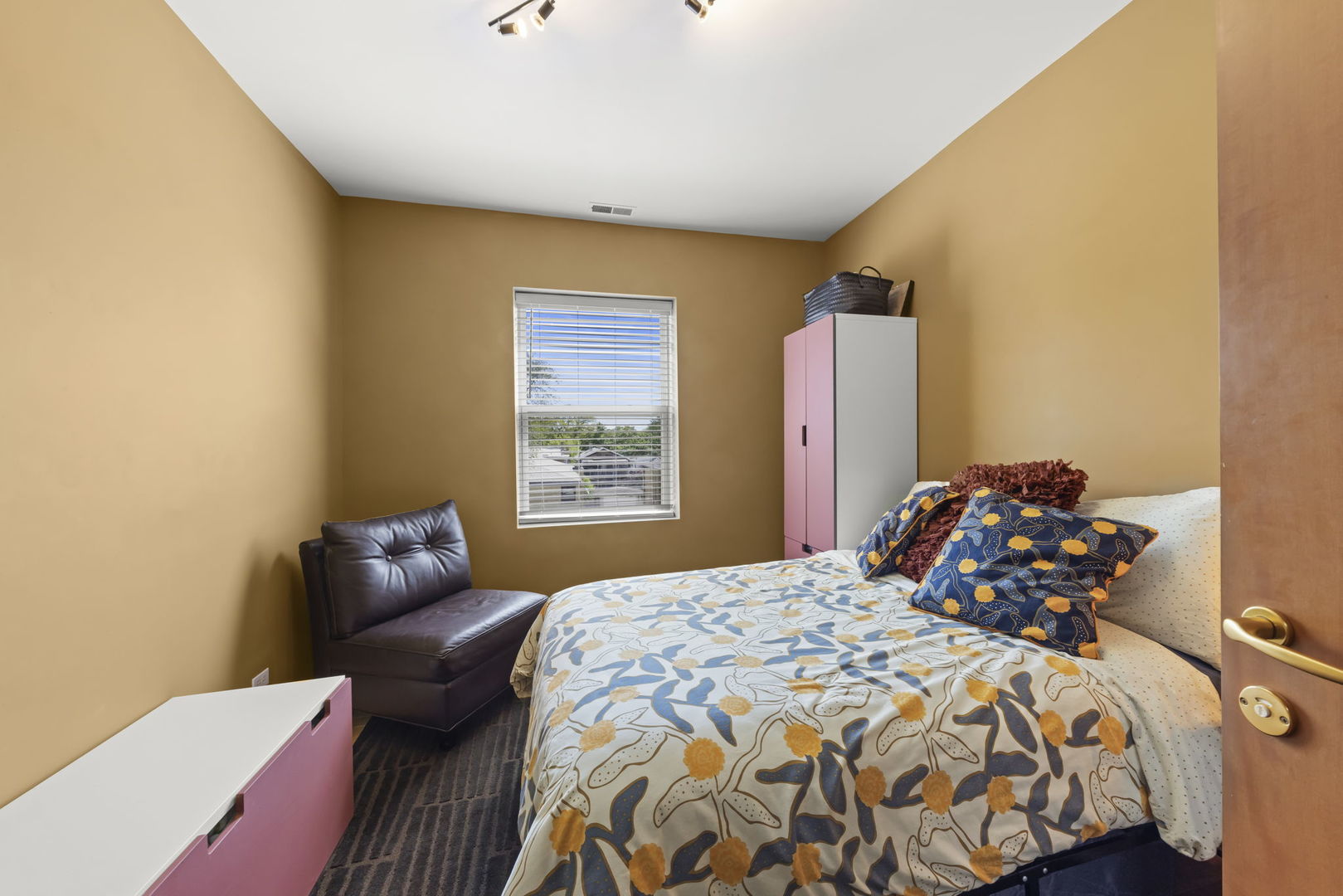 5054 North Troy Street, Unit 3 Chicago, IL 60625 - Photo 18 of 31 a bedroom with a bed and a couch