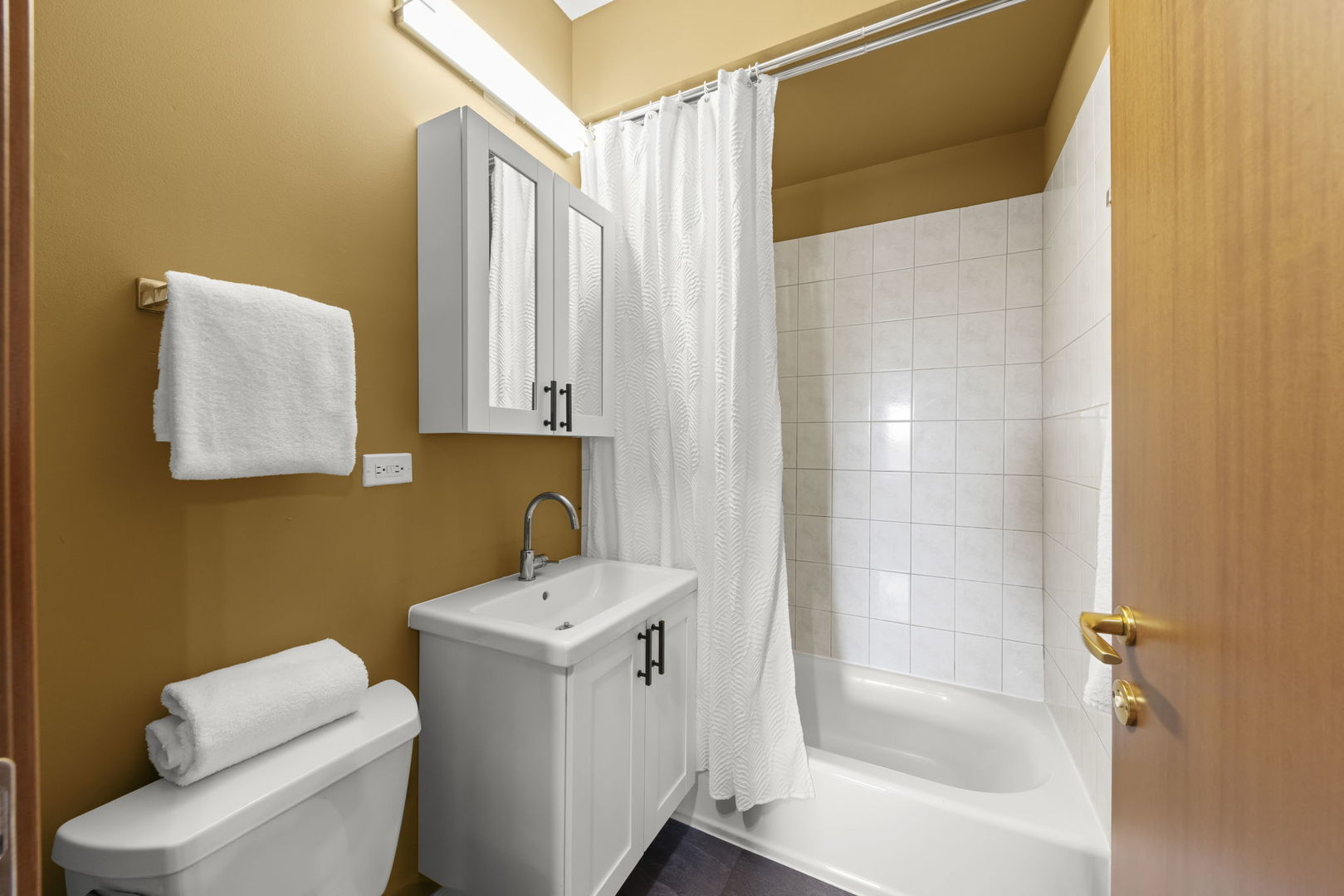 5054 North Troy Street, Unit 3 Chicago, IL 60625 - Photo 20 of 31 a bathroom with a sink toilet and shower