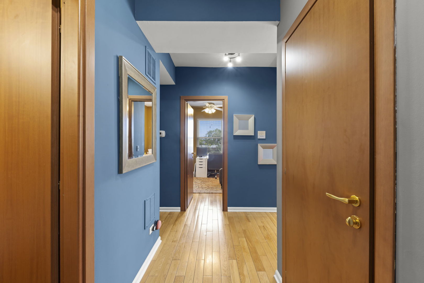 5054 North Troy Street, Unit 3 Chicago, IL 60625 - Photo 2 of 31 a view of a hallway with wooden floor and staircase