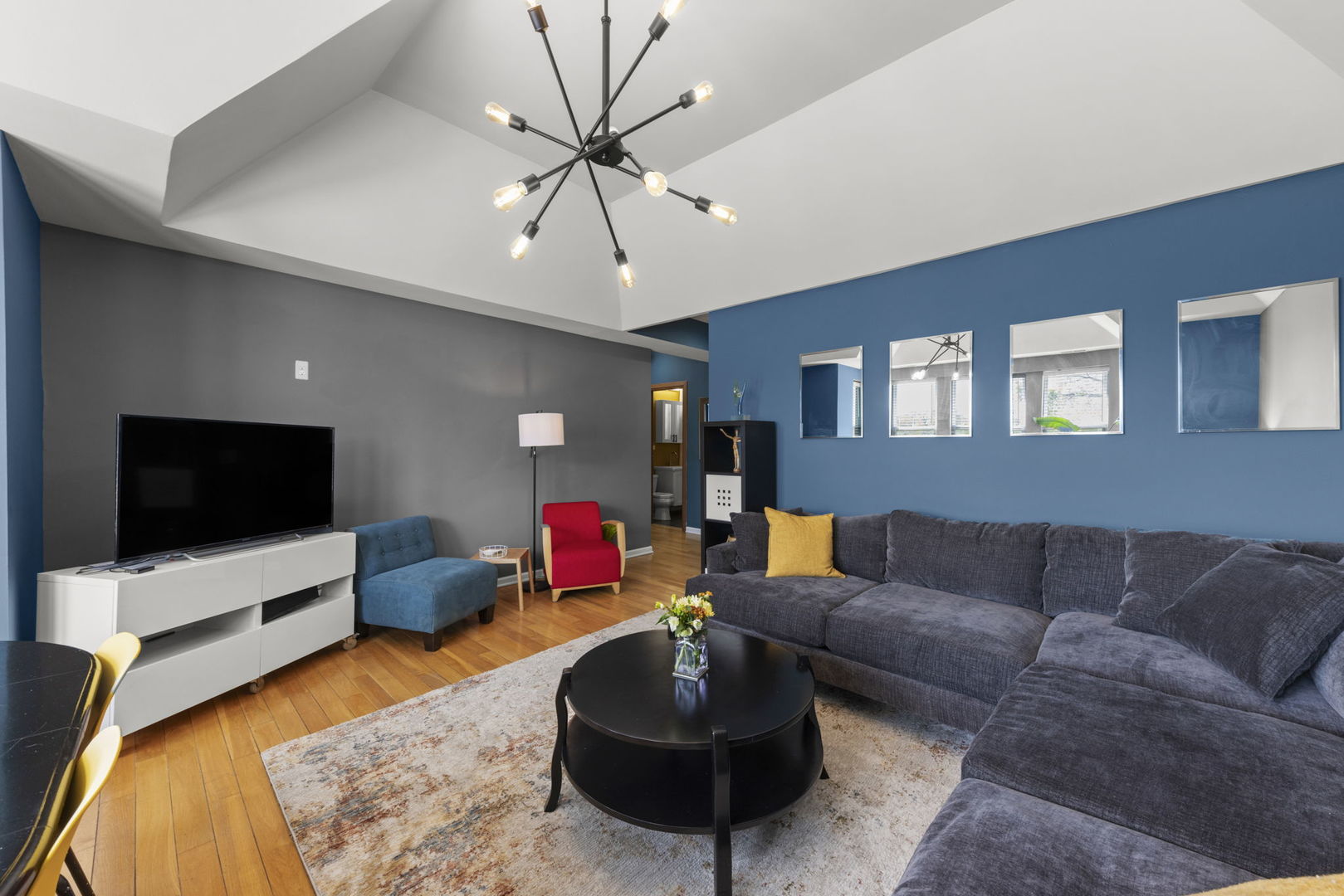 5054 North Troy Street, Unit 3 Chicago, IL 60625 - Photo 3 of 31 a living room with furniture and a flat screen tv