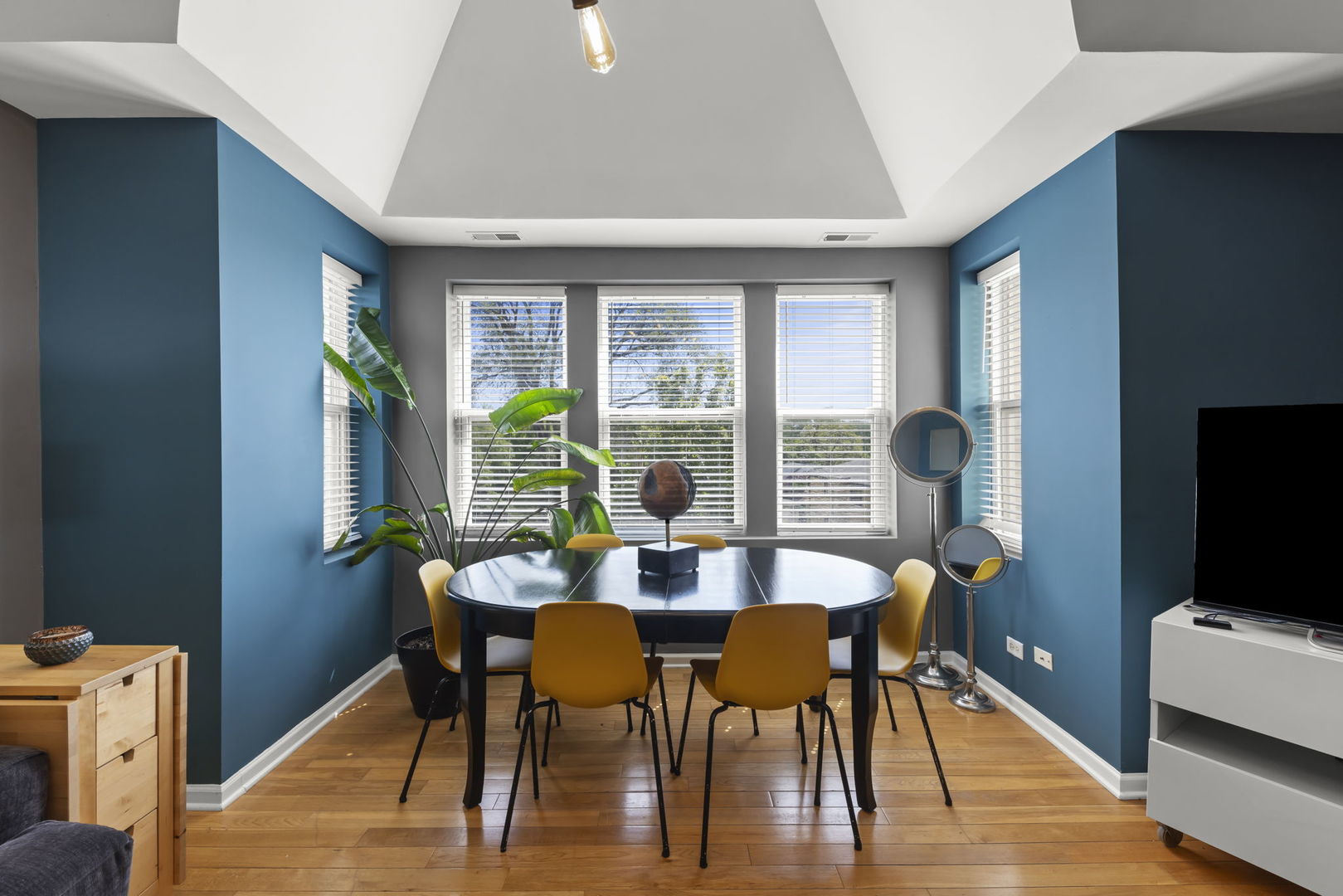 5054 North Troy Street, Unit 3 Chicago, IL 60625 - Photo 5 of 31 a view of a dining room with furniture window and wooden floor