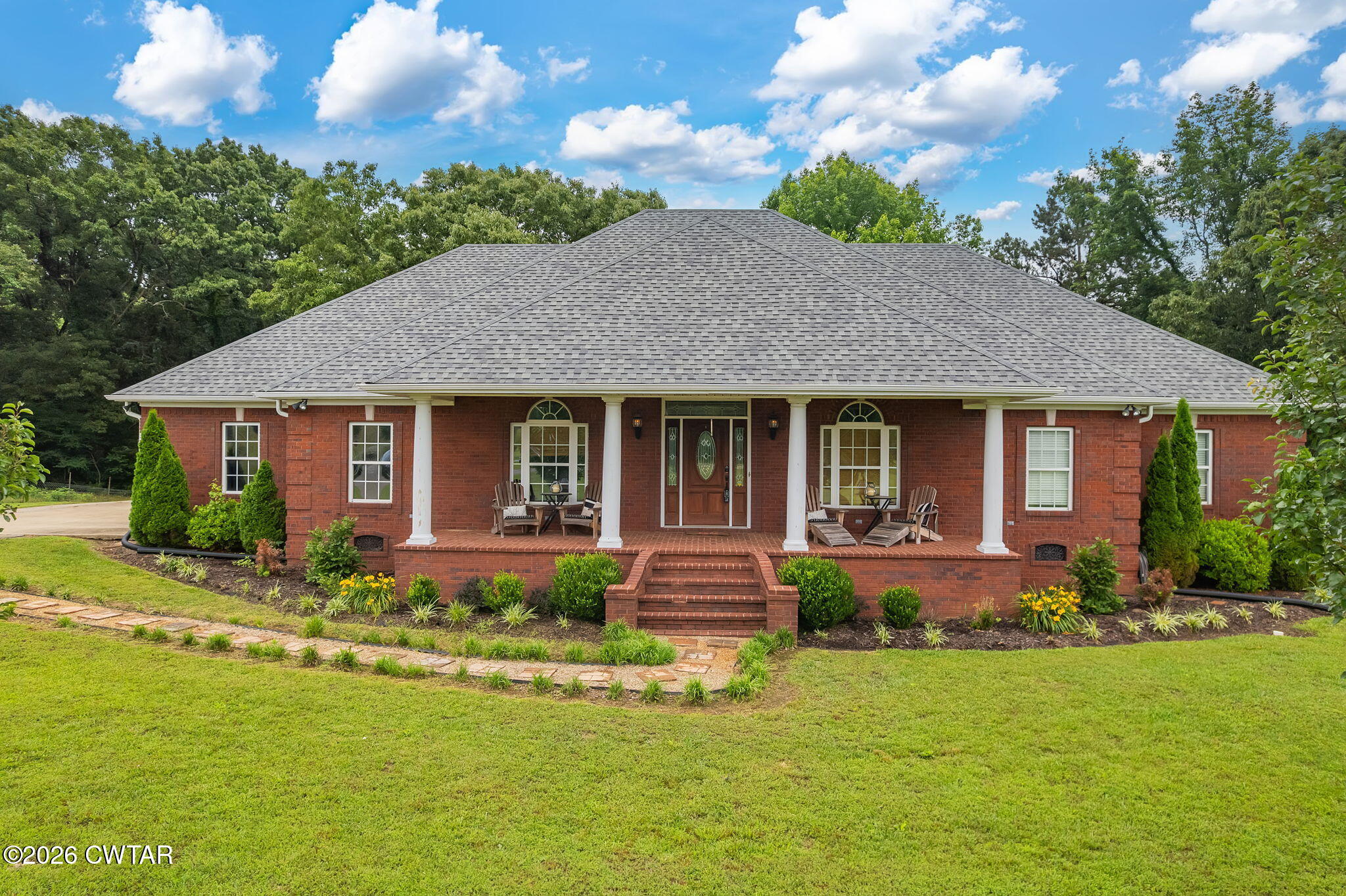 4320 Timberlake-Wildersville Road Lexington, TN 38351 - Photo 43 of 58 a front view of a house with garden and porch