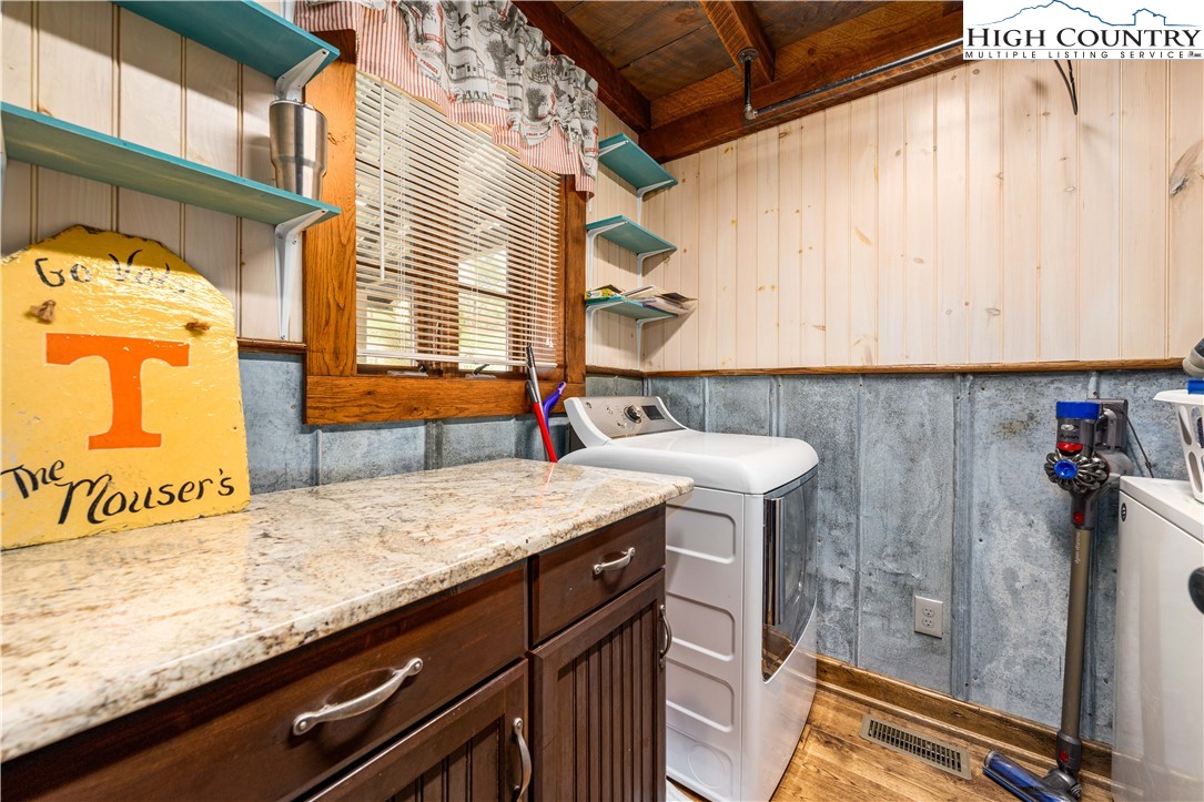 110 North River Lane Butler, TN 37640 - Photo 17 of 50 a bathroom with a granite countertop sink and a mirror