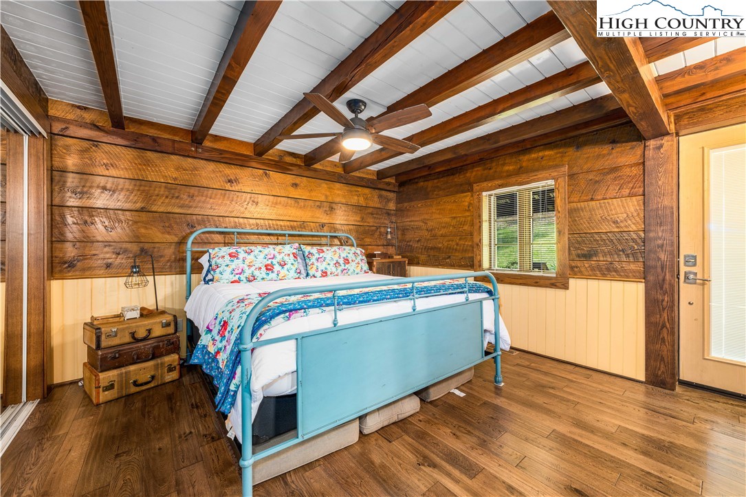 110 North River Lane Butler, TN 37640 - Photo 18 of 50 a bedroom with a bed and wooden floor