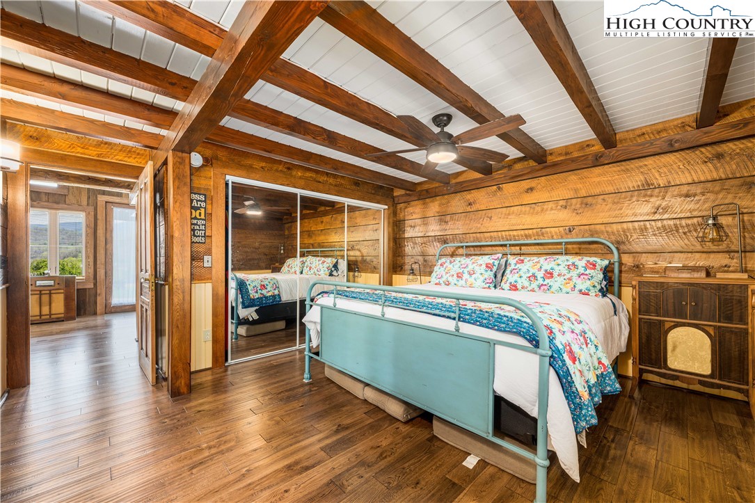 110 North River Lane Butler, TN 37640 - Photo 19 of 50 a bedroom with a bed and wooden floor