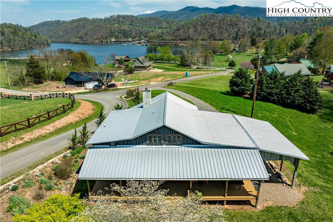 110 North River Lane Butler, TN 37640 - Photo 2 of 50 a view of a patio with furniture and a lake view