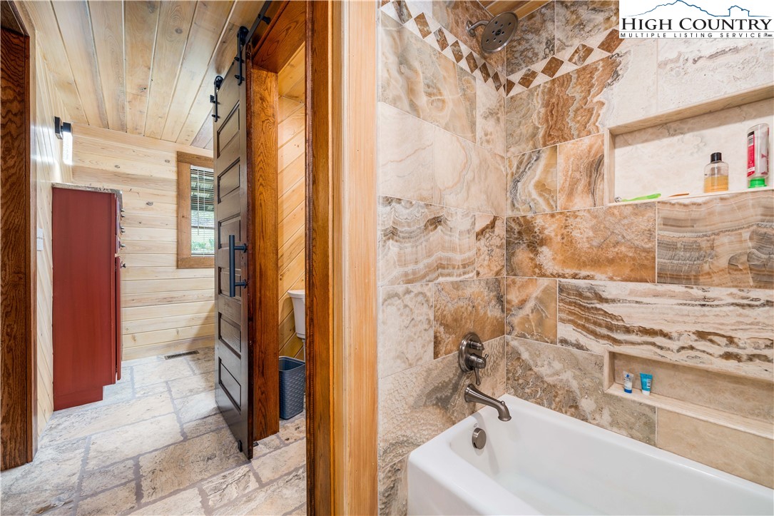 110 North River Lane Butler, TN 37640 - Photo 22 of 50 a bathroom with a sink and a shower