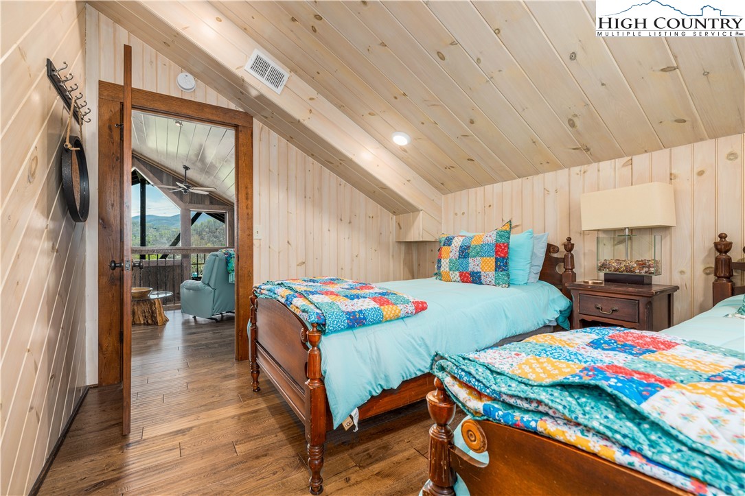 110 North River Lane Butler, TN 37640 - Photo 28 of 50 a bedroom with a bed and a table in it