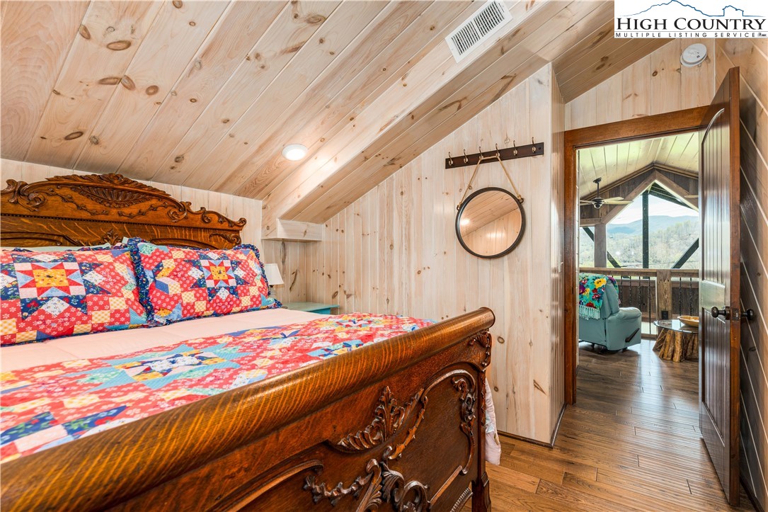 110 North River Lane Butler, TN 37640 - Photo 30 of 50 a bedroom with a bed a dresser and next to a window