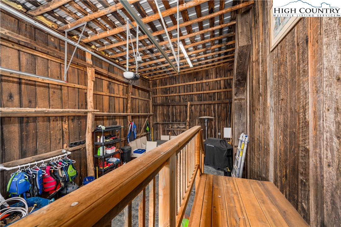 110 North River Lane Butler, TN 37640 - Photo 33 of 50 a view of balcony with wooden floor and potted plants