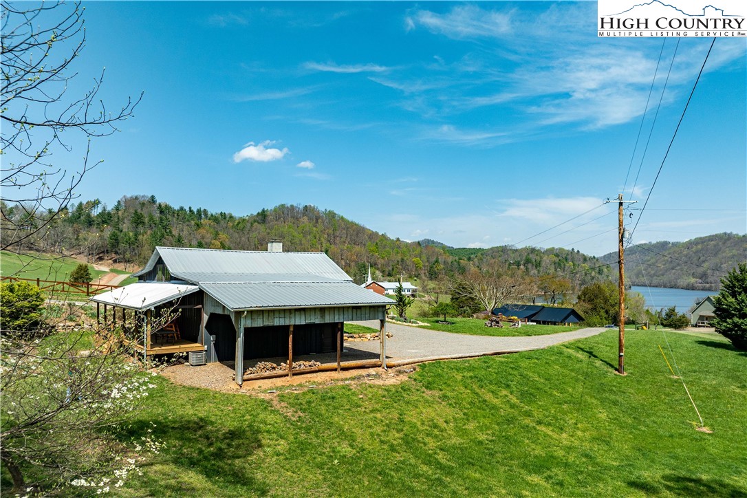 110 North River Lane Butler, TN 37640 - Photo 38 of 50 a view of a house with pool and a yard