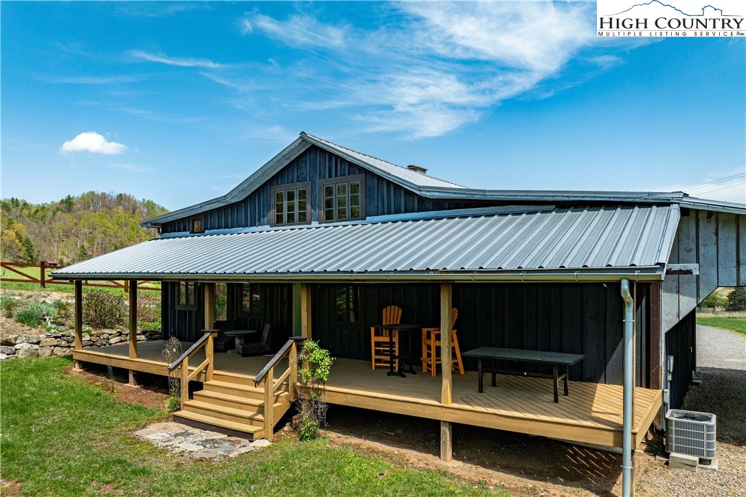 110 North River Lane Butler, TN 37640 - Photo 40 of 50 a front view of a house with swimming pool and sitting area