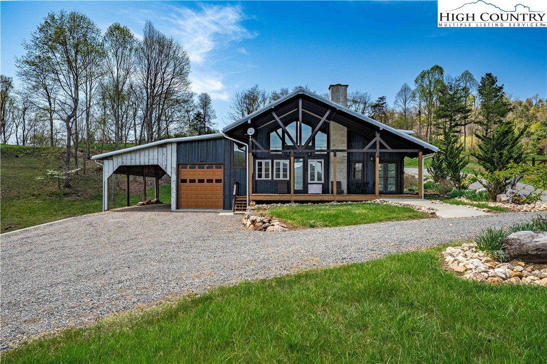 110 North River Lane Butler, TN 37640 - Photo 42 of 50 a view of a house with a big yard plants and large trees