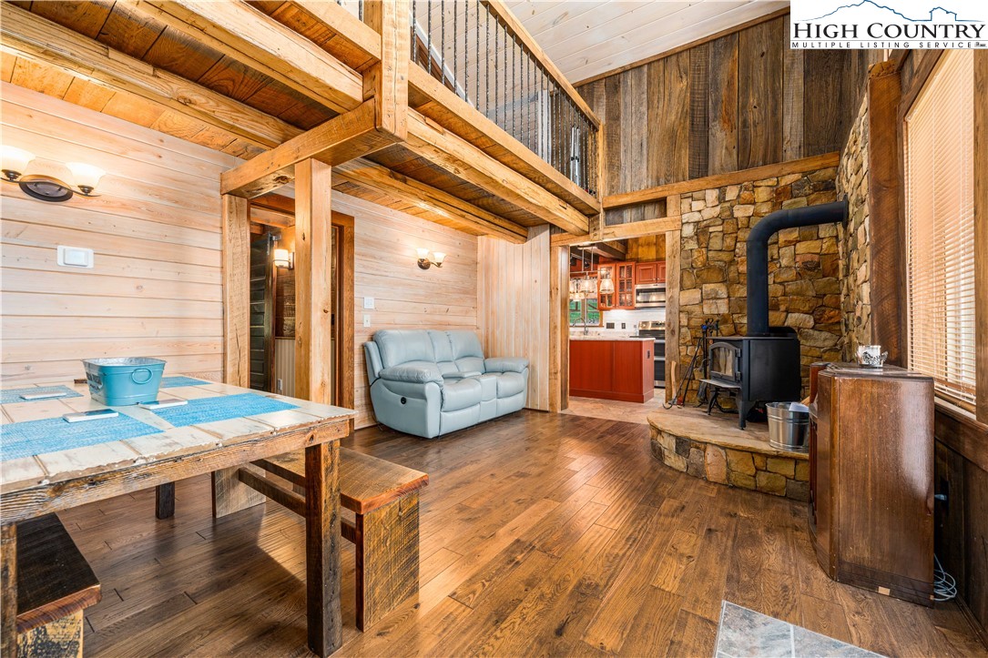 110 North River Lane Butler, TN 37640 - Photo 7 of 50 a view of a dining room with furniture a kitchen and chandelier