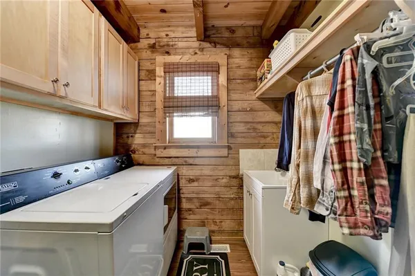 a bathroom with a sink a mirror and shower