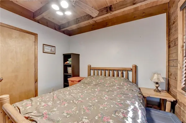 a bedroom with a bed and a table in it