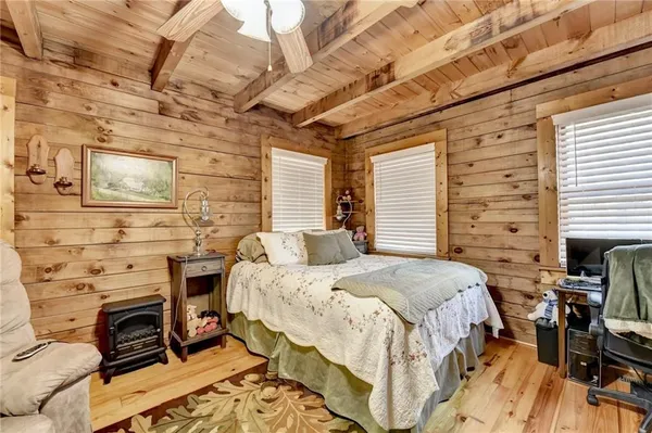 a bedroom with a bed and a fireplace