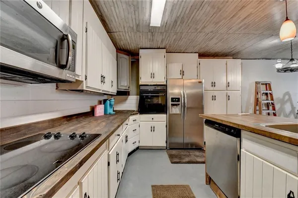 a kitchen with a stove and a refrigerator